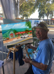 Lloyd Dobson Artist painting a commissioned oil painting of Beach Bazaar located in the Siesta Key Village