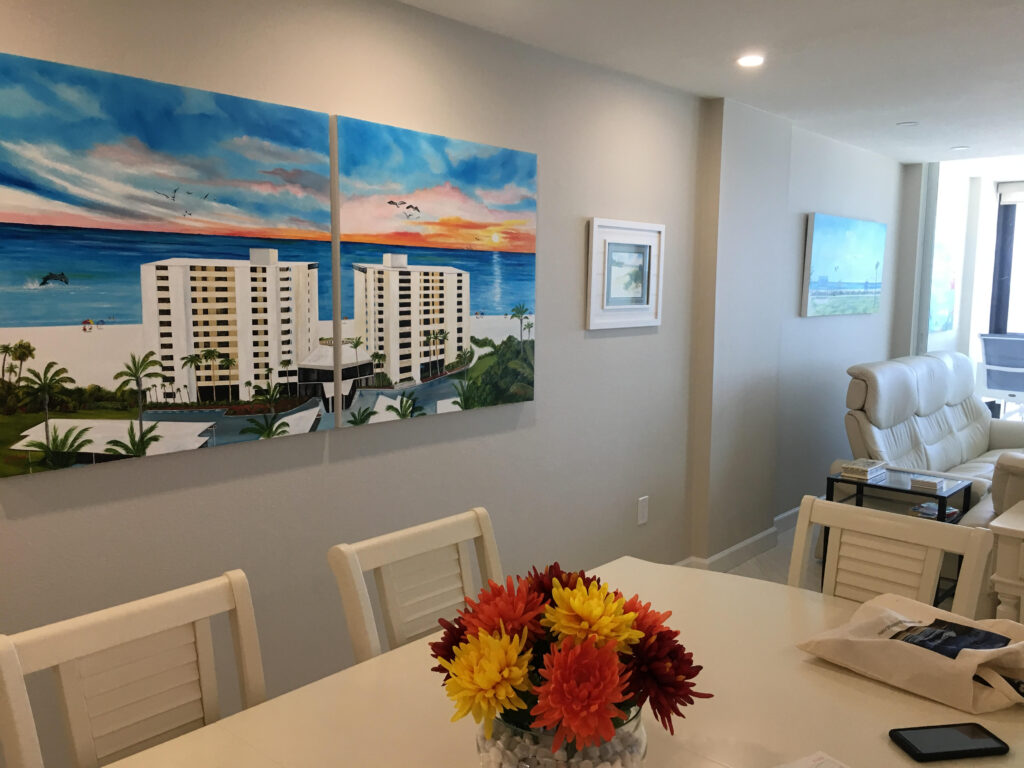 Inside dining room view of oil painting by Lloyd Dobson Artist in Whispering Sands Condo complex