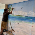 Lloyd Dobson Artist painting a mural