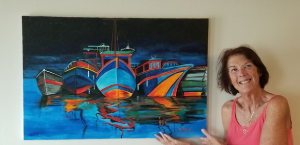 Art client holding an oil painting by Lloyd Dobson Artist