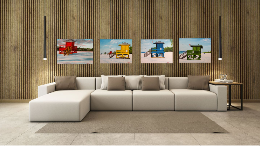 Four Siesta Key Beach lifeguard stands hanging over a livingroom sofa oil paintings by Lloyd Dobson Artist